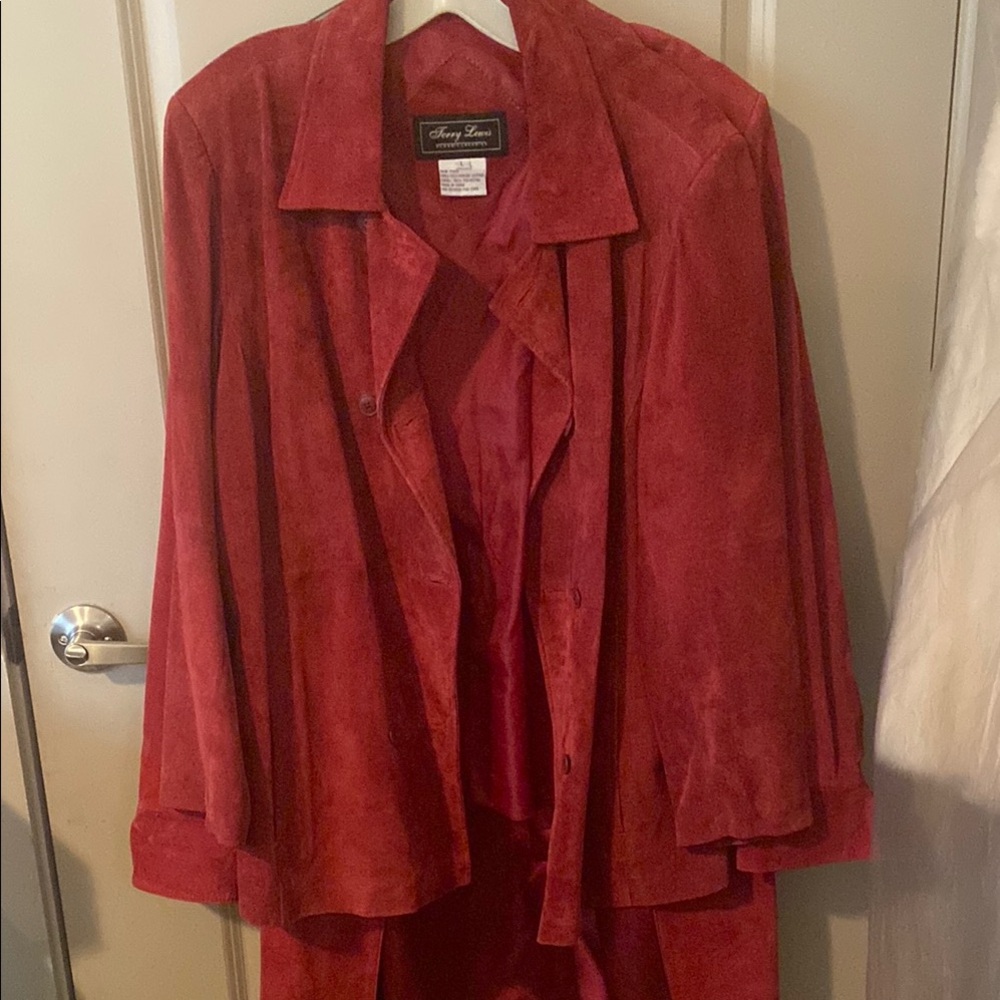 Terry Lewis suede jacket. Skirt and trench coat sold separately.